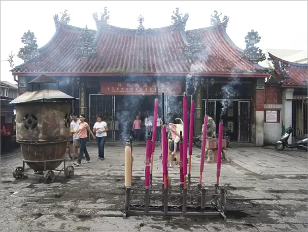 Devotional incense sticks burning outside the Goddess of Mercy Chinese temple