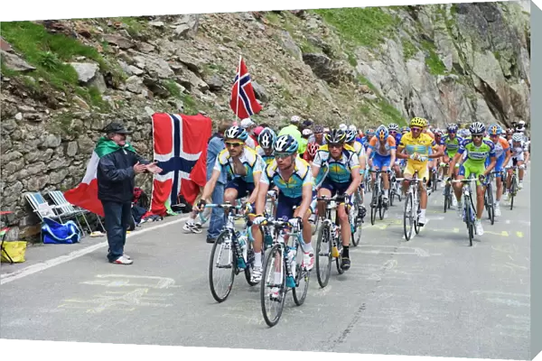Cyclists including Lance Armstrong and yellow jersey Alberto Contador in the Tour de France 2009