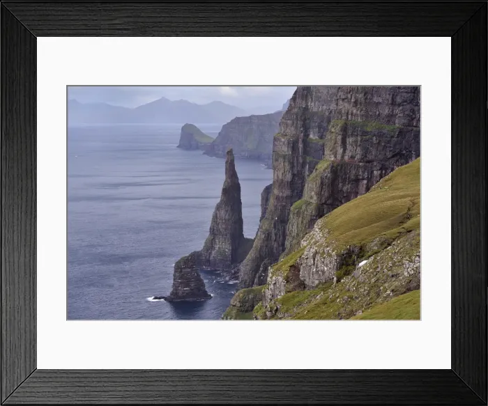 Framed Print : Spectacular 300-400m high cliffs on west coast of Sandoy, Oknadalsdrangur sea stack in foreground Framed Print : Spectacular 300-400m high cliffs on west coast of Sandoy, Oknadalsdrangur sea stack in foreground