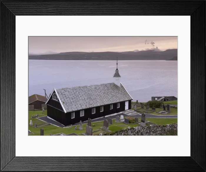 Framed Print : Wooden church at Nes dating from 1843, view across Tangafjordur towards Streymoy Framed Print : Wooden church at Nes dating from 1843, view across Tangafjordur towards Streymoy