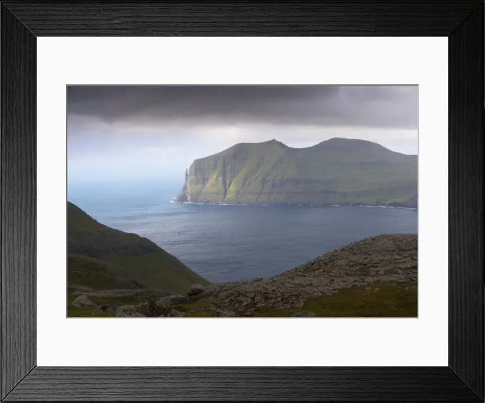 Framed Print : East coast of Vagar island seen across Vagarfjordur, with Trollkonufingur Framed Print : East coast of Vagar island seen across Vagarfjordur, with Trollkonufingur