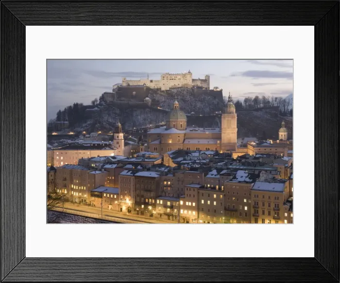 Framed Print : Snow covered Old Town with towers of Glockenspiel, Dom and Franziskanerkirche churches dominated by the fortress of Festung Hohensalzburg at twilight, Salzburg Framed Print : Snow covered Old Town with towers of Glockenspiel, Dom and Franziskanerkirche churches dominated by the fortress of Festung Hohensalzburg at twilight, Salzburg