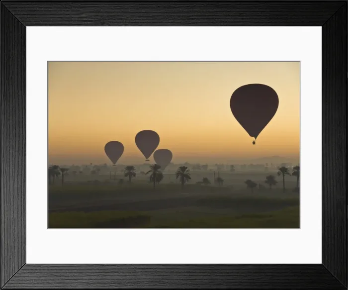 Framed Print : Lots of hot air balloons flying over the desert at sunrise west of the river Nile near Luxor Framed Print : Lots of hot air balloons flying over the desert at sunrise west of the river Nile near Luxor