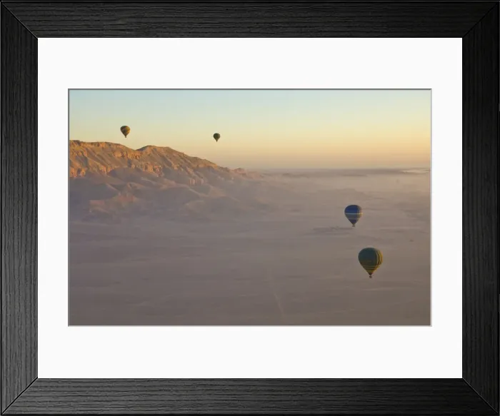 Framed Print : Hot air balloons on an excursion flying over the desert early morning at dawn Framed Print : Hot air balloons on an excursion flying over the desert early morning at dawn