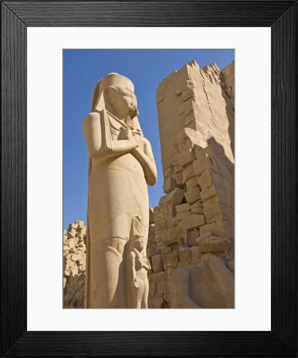 Framed Print : Giant statue of the great pharaoh Rameses II with the small statue of his daughter Bent anta between his legs in the forecourt behind the first Pylon of the great Temple at Karnak near Luxor, Thebes, UNESCO World Heritage Site, Egypt, North Framed Print : Giant statue of the great pharaoh Rameses II with the small statue of his daughter Bent anta between his legs in the forecourt behind the first Pylon of the great Temple at Karnak near Luxor, Thebes, UNESCO World Heritage Site, Egypt, North