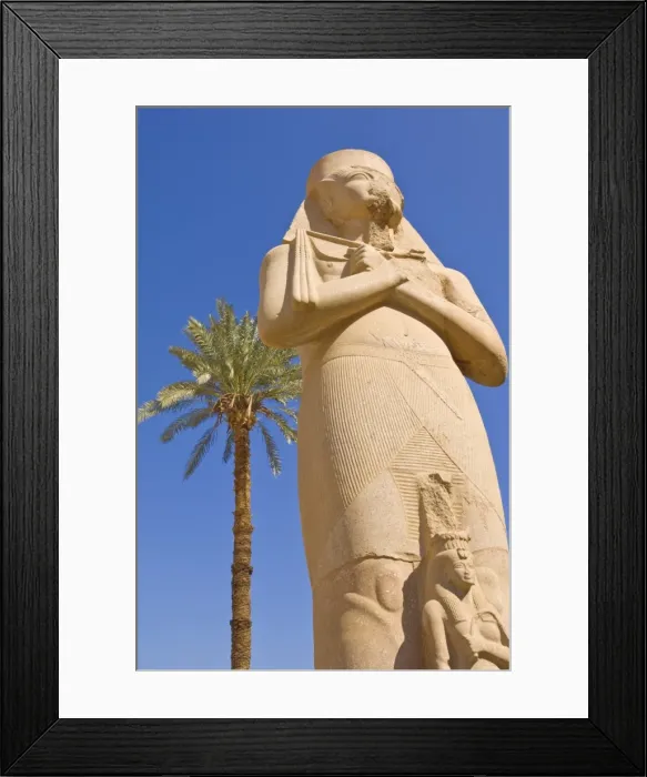 Framed Print : Statue of the great pharaoh Rameses II with small statue of his daughter Bent anta between his legs in the forecourt behind the first Pylon of the great Temple at Karnak, near Luxor, Thebes, UNESCO World Heritage Site, Egypt, North Framed Print : Statue of the great pharaoh Rameses II with small statue of his daughter Bent anta between his legs in the forecourt behind the first Pylon of the great Temple at Karnak, near Luxor, Thebes, UNESCO World Heritage Site, Egypt, North