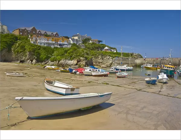 Small fishing boats and yachts at low tide, Newquay harbour, Newquay, Cornwall