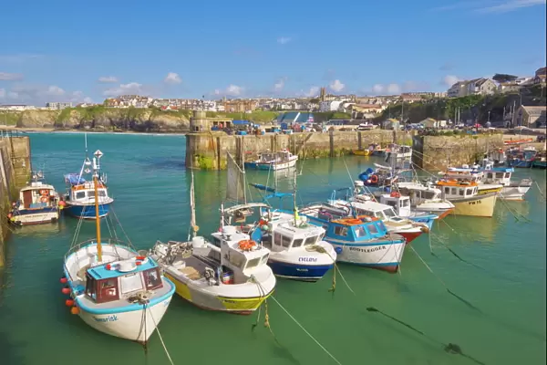 Small fishing boats in the harbour at high tide, Newquay, North Cornwall
