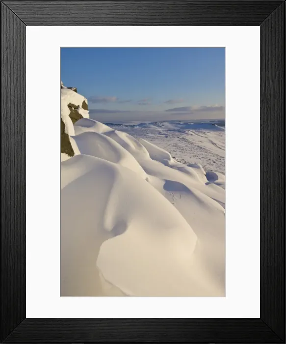 Framed Print : Snow drifts and snow covered moorland at Stanage Edge, Peak District National Park Framed Print : Snow drifts and snow covered moorland at Stanage Edge, Peak District National Park