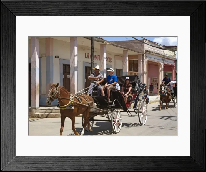 Framed Print : Tourists enjoying a horse-drawn buggy ride through Moron, Ciego de Cvila Framed Print : Tourists enjoying a horse-drawn buggy ride through Moron, Ciego de Cvila