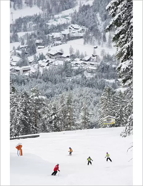 Skiers on piste above Seefeld village, Seefeld, the Tyrol, Austria, Europe