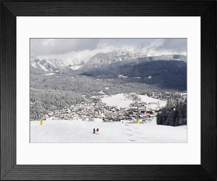 Framed Print : Skiers on a piste above Seefeld village, Seefeld, the Tyrol, Austria, Europe Framed Print : Skiers on a piste above Seefeld village, Seefeld, the Tyrol, Austria, Europe