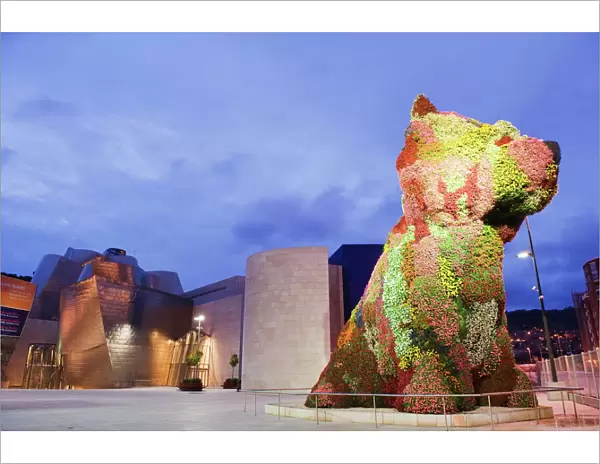 The Guggenheim, designed by architect Frank Gehry, and Puppy, the dog flower sculpture by Jeff Koons, Bilbao, Basque country