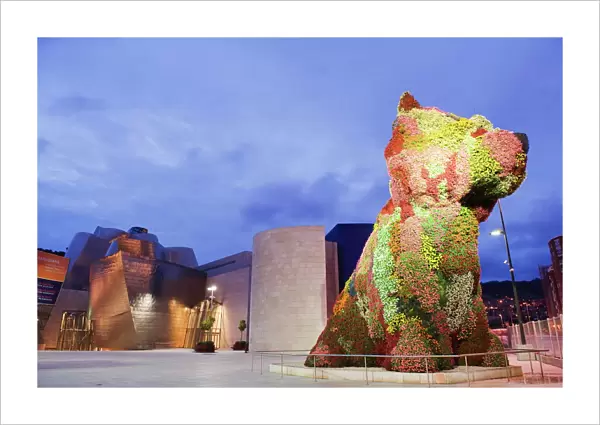 The Guggenheim, designed by architect Frank Gehry, and Puppy, the dog flower sculpture by Jeff Koons, Bilbao, Basque country