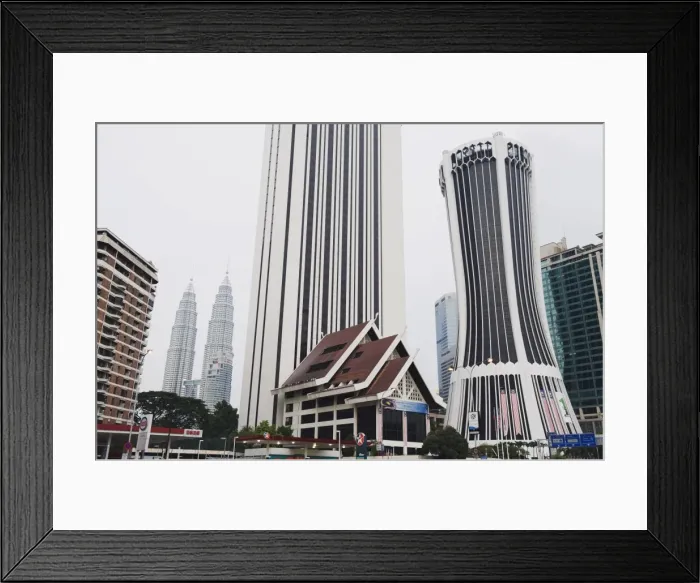 Framed Print : Petronas Towers and Tabung Haji Building, designed by Hijas Katsuri, Kuala Lumpur Framed Print : Petronas Towers and Tabung Haji Building, designed by Hijas Katsuri, Kuala Lumpur