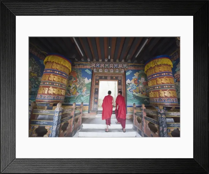 Framed Print : Monks walking between prayer wheels at Trongsa Dzong (Chokhor Raptentse) dating from 1648