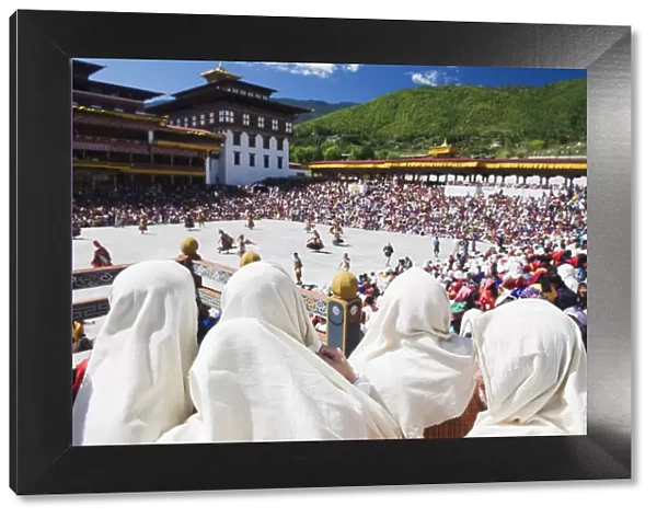 Spectators watching the Autumn Tsechu (festival) at Trashi Chhoe Dzong