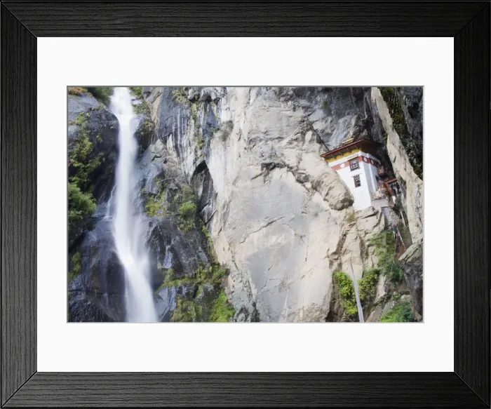 Framed Print : A waterfall flowing past a temple built into the side of a cliff, Tigers Nest Framed Print : A waterfall flowing past a temple built into the side of a cliff, Tigers Nest