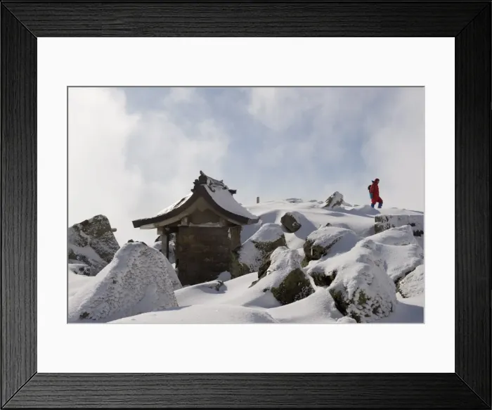 Framed Print : Shrine and climber on snow covered Iwaki San mountain, Aomori prefecture, Japan, Asia