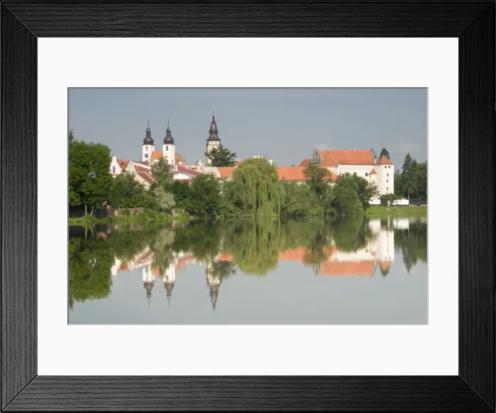 Framed Print : Telc Chateau and residential buildings reflected in Stepnicky Pond, Telc Framed Print : Telc Chateau and residential buildings reflected in Stepnicky Pond, Telc
