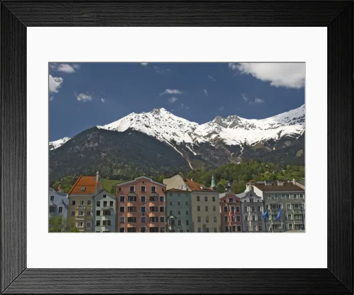 Framed Print : Candy coloured houses with backdrop of mountains in spring snow, Innsbruck Framed Print : Candy coloured houses with backdrop of mountains in spring snow, Innsbruck