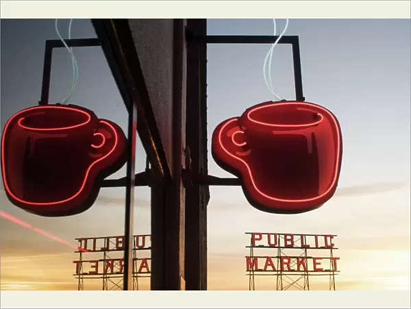 Neon coffee mug reflected in coffee shop window with the Pike Place Market behind