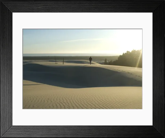 Framed Print : Woman walking barefoot on sand dunes torwards the Pacific Ocean, Southern Oregon