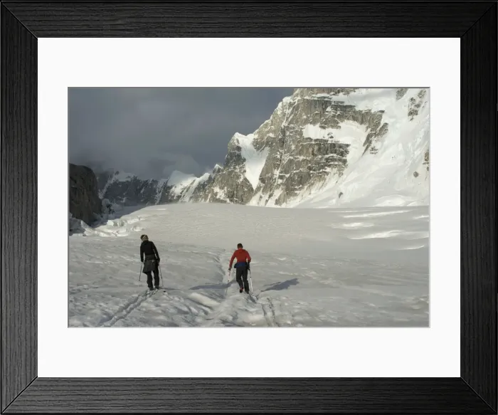 Framed Print : Two men ski towards the Moonflower Buttress, Denali National Park, Alaska Framed Print : Two men ski towards the Moonflower Buttress, Denali National Park, Alaska