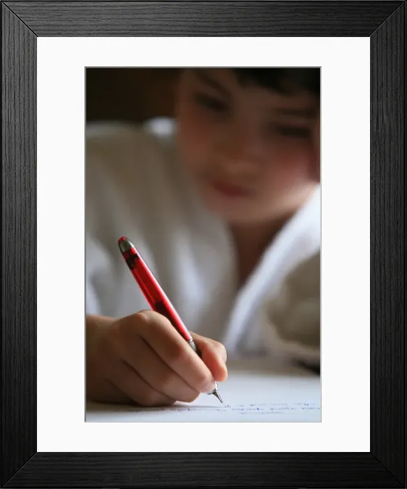 Framed Print : Boy writing a letter, France, Europe Framed Print : Boy writing a letter, France, Europe