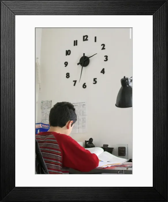 Framed Print : An 11-year old boy doing homework, Paris, France, Europe Framed Print : An 11-year old boy doing homework, Paris, France, Europe