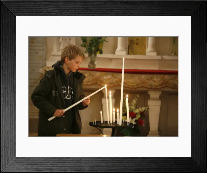 Framed Print : Child lighting a church candle, Toucy, Yonne, France, Europe Framed Print : Child lighting a church candle, Toucy, Yonne, France, Europe