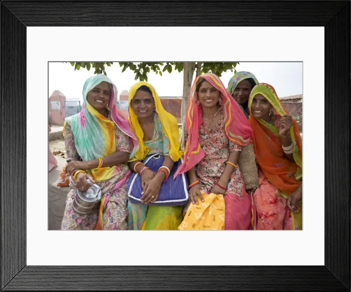 Framed Print : Women waiting for village jeep after their morning shift working with cows Framed Print : Women waiting for village jeep after their morning shift working with cows