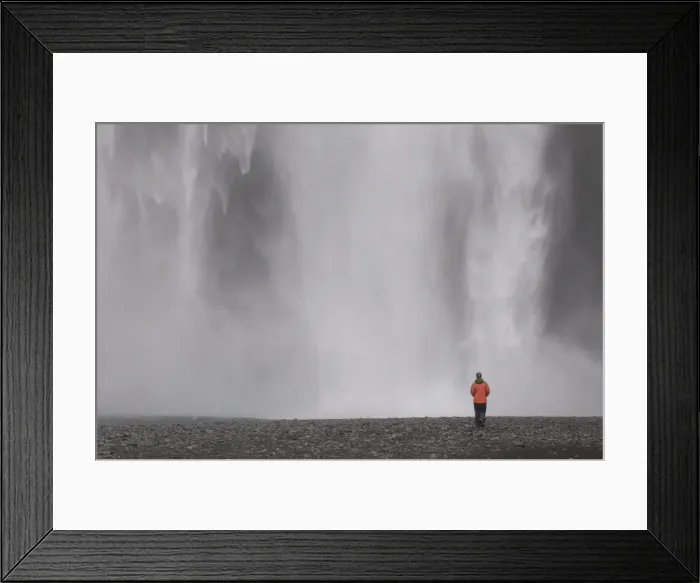 Framed Print : Young woman admiring the big waterfall of Skogarfoss, Iceland, Polar Regions Framed Print : Young woman admiring the big waterfall of Skogarfoss, Iceland, Polar Regions