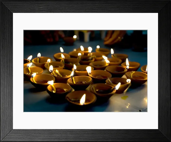 Framed Print : Deepak lights (oil and cotton wick candles) lit for domestic decoration to celebrate the Diwali festival Framed Print : Deepak lights (oil and cotton wick candles) lit for domestic decoration to celebrate the Diwali festival