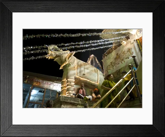 Framed Print : Saddhus sit under decorative marble elephant at the entrance to the Jagdish temple at Diwali Framed Print : Saddhus sit under decorative marble elephant at the entrance to the Jagdish temple at Diwali