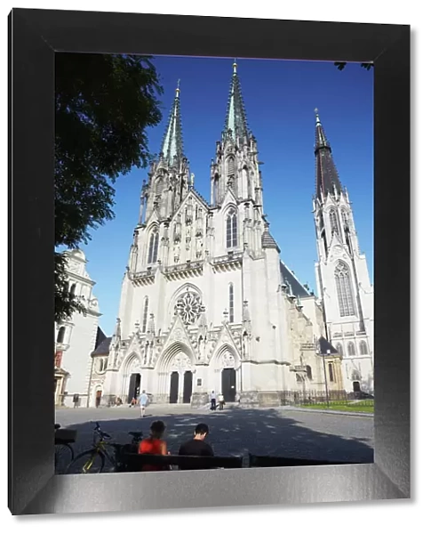 People sitting in front of St. Wenceslas Cathedral, Olomouc, Moravia, Czech Republic