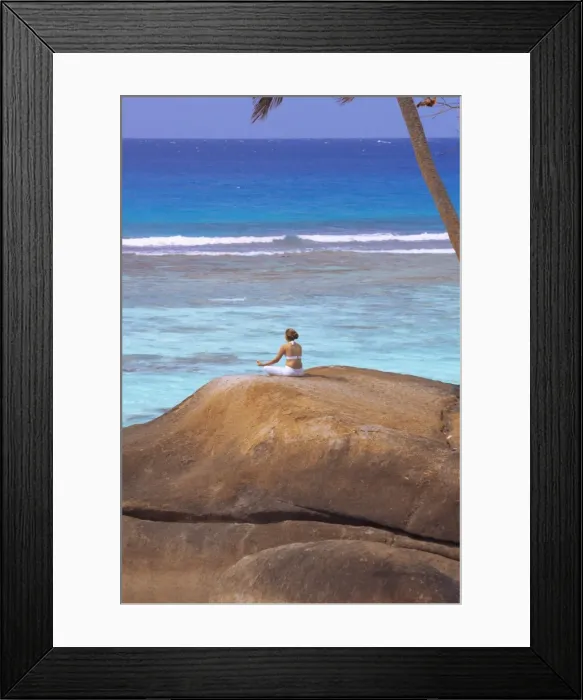 Framed Print : Young woman meditating on rock, Seychelles, Indian Ocean, Africa Framed Print : Young woman meditating on rock, Seychelles, Indian Ocean, Africa