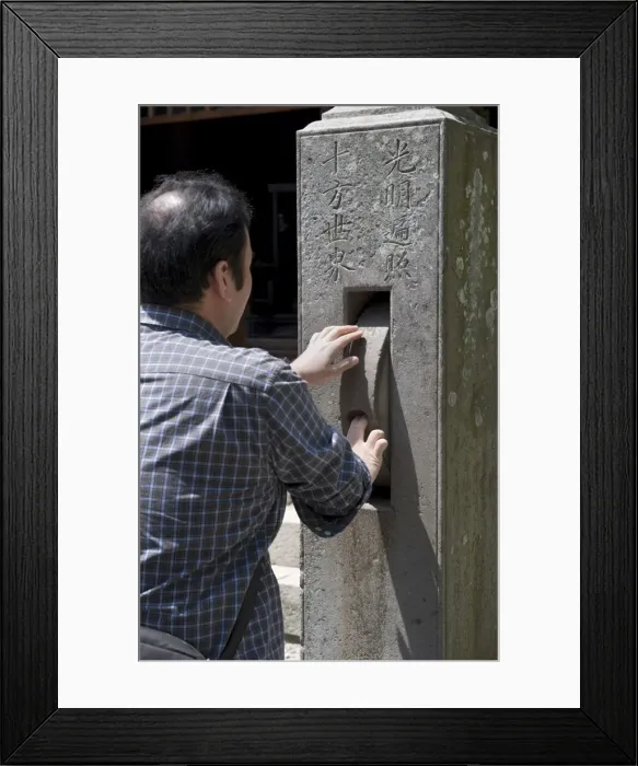 Framed Print : Man spinning a prayer wheel at Zenkoji Temple, Nagano City, Japan, Asia Framed Print : Man spinning a prayer wheel at Zenkoji Temple, Nagano City, Japan, Asia
