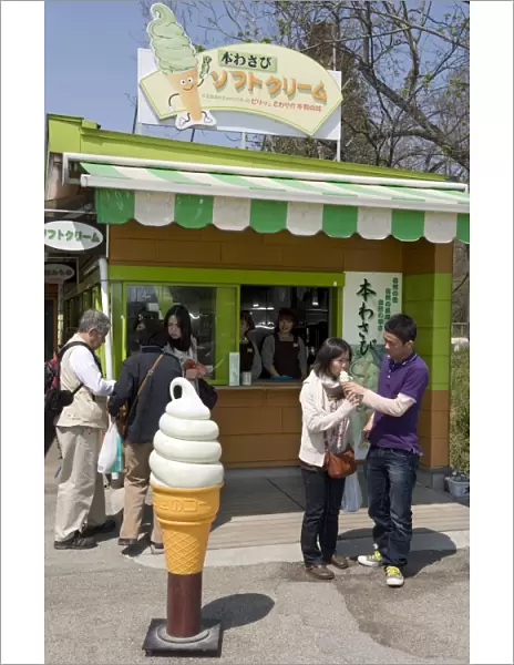 Visitors enjoying wasabi (Japanese horseradish) ice cream at the Daio Wasabi Farm in Hotaka