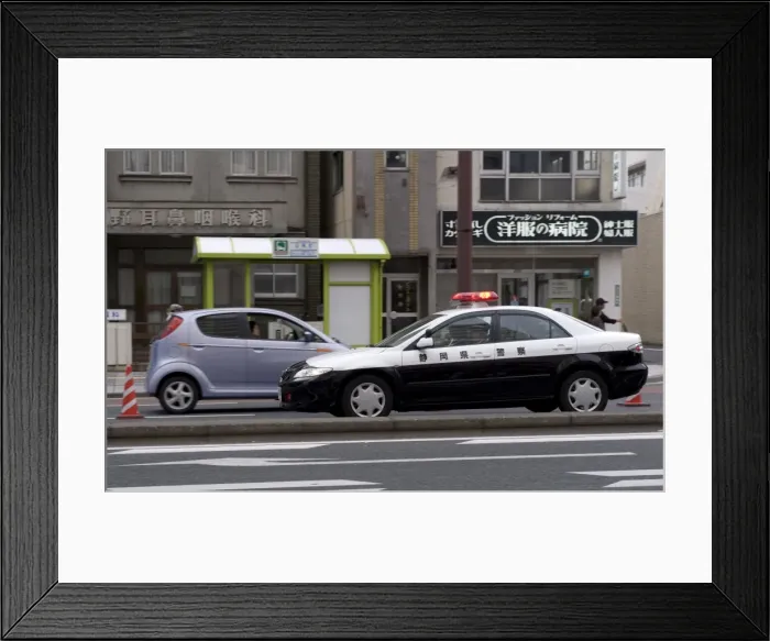 Framed Print : A police car from Shizuoka Prefecture speeding past, Tokyo, Japan, Asia Framed Print : A police car from Shizuoka Prefecture speeding past, Tokyo, Japan, Asia