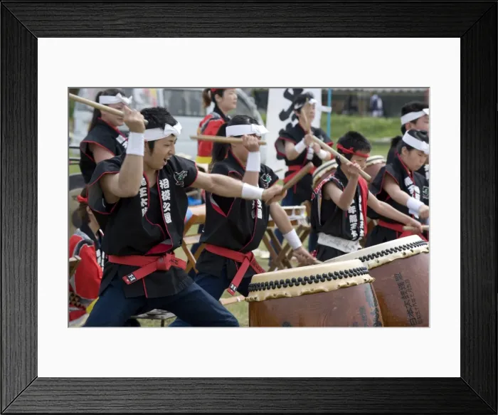Framed Print : Energetic group of drummers beating Japanese taiko drums during an outdoor performance Framed Print : Energetic group of drummers beating Japanese taiko drums during an outdoor performance