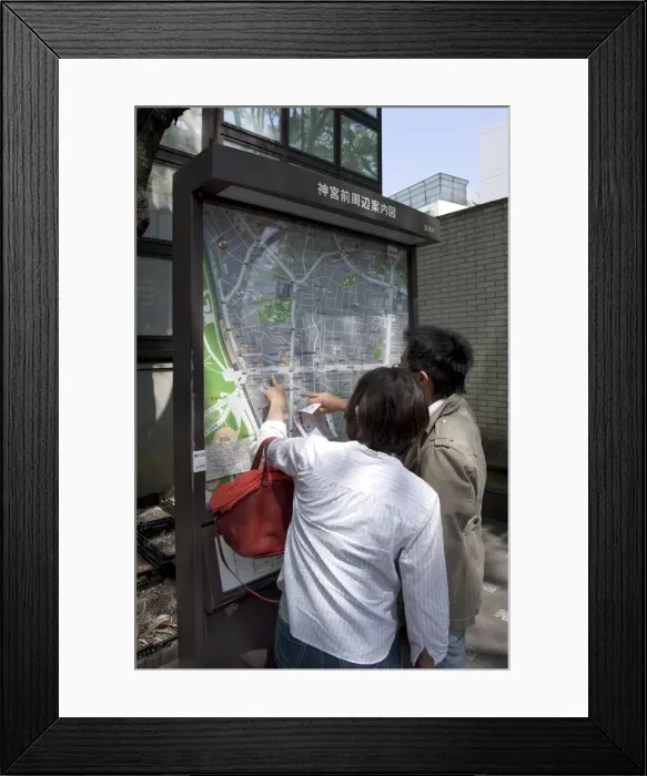 Framed Print : Visitors looking at a Tokyo city map in the Omotesando neighbourhood of Shibuya Framed Print : Visitors looking at a Tokyo city map in the Omotesando neighbourhood of Shibuya