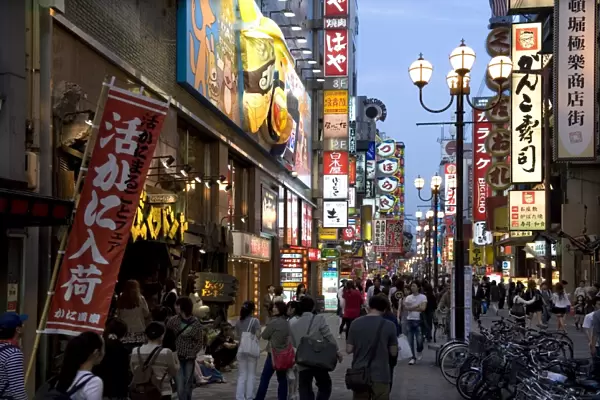 Neon signs bring Dotonbori entertainment district to life after sunset, Osaka, Japan