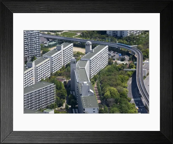 Framed Print : Monorail train weaving through housing development on Sakishima Island, Osaka, Japan Framed Print : Monorail train weaving through housing development on Sakishima Island, Osaka, Japan