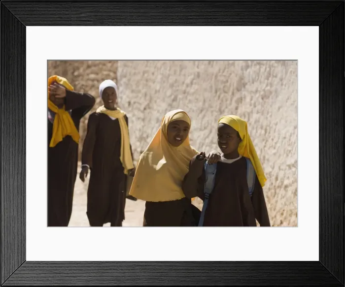 Framed Print : Girls stepping out of school in Harar, Ethiopia, Africa Framed Print : Girls stepping out of school in Harar, Ethiopia, Africa