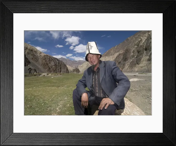 Framed Print : Smiling man with traditional Kyrgyz hats, Madyian, Tajikistan, Central Asia, Asia