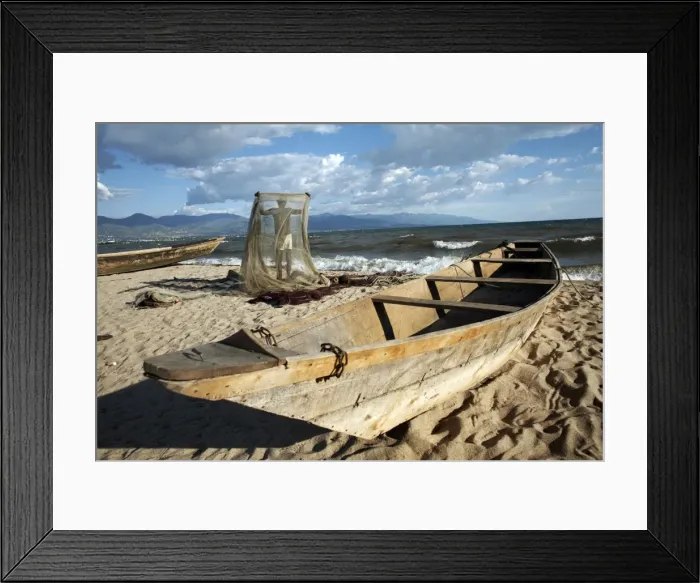 Framed Print : A fisherman tends his nets on Plage des Cocotiers (Coconut Beach) also known as Saga Beach Framed Print : A fisherman tends his nets on Plage des Cocotiers (Coconut Beach) also known as Saga Beach