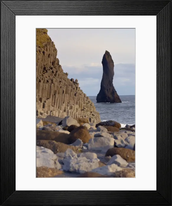 Framed Print : Columnar basalt cliffs and Reynisdrangar sea stack standing in the sea Framed Print : Columnar basalt cliffs and Reynisdrangar sea stack standing in the sea
