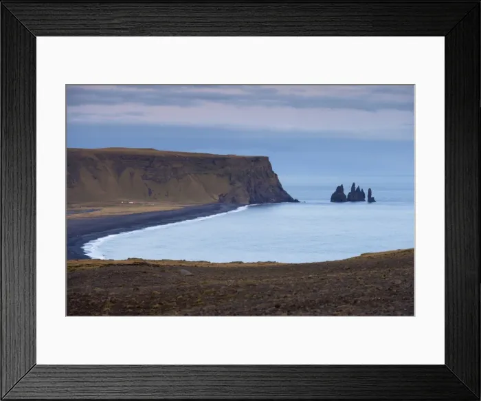 Framed Print : Black sand beach, rock formation and Reynisdrangar sea stacks in the distance Framed Print : Black sand beach, rock formation and Reynisdrangar sea stacks in the distance
