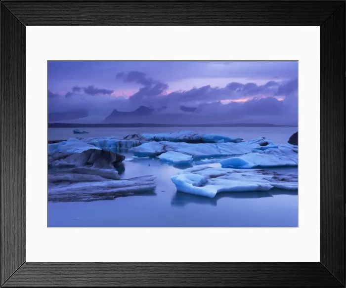 Framed Print : Icebergs in Jokulsarlon glacial lagoon, at dusk, Oraefajokull (Vatnajokull) glacier in the distance Framed Print : Icebergs in Jokulsarlon glacial lagoon, at dusk, Oraefajokull (Vatnajokull) glacier in the distance